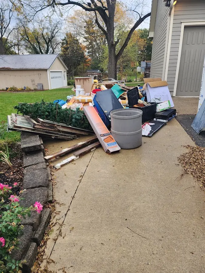 Dumpster being loaded with debris for Residential Dumpster Rental in Winton